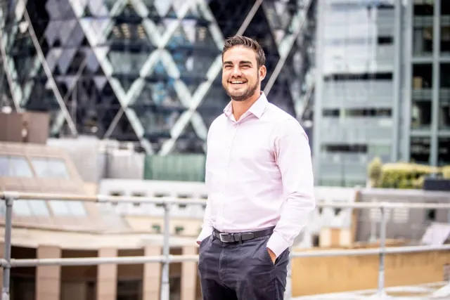 Dean Biddulph, Director at BetterFXRates, on a rooftop in the City of London